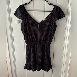 Navy blue polka dotted romper